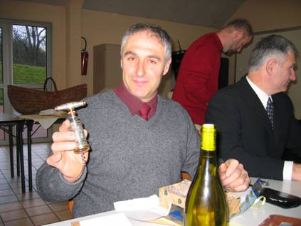 Guy Chaumont holding a corkscrew